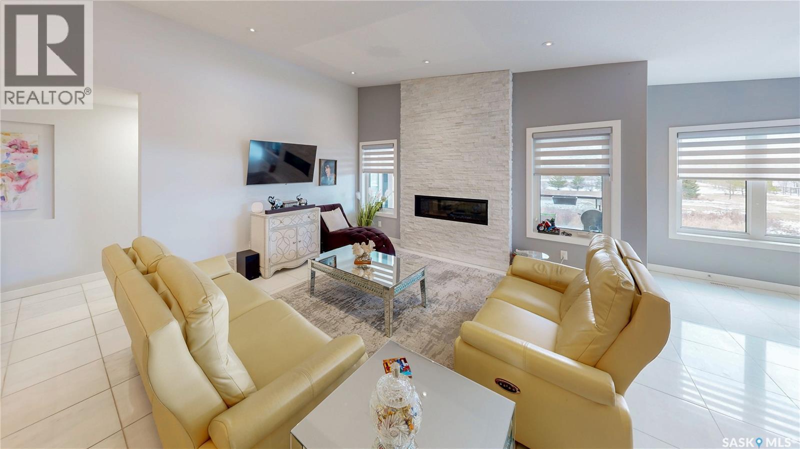 4369 Albulet Drive, Regina, SK - Indoor Photo Showing Living Room With Fireplace