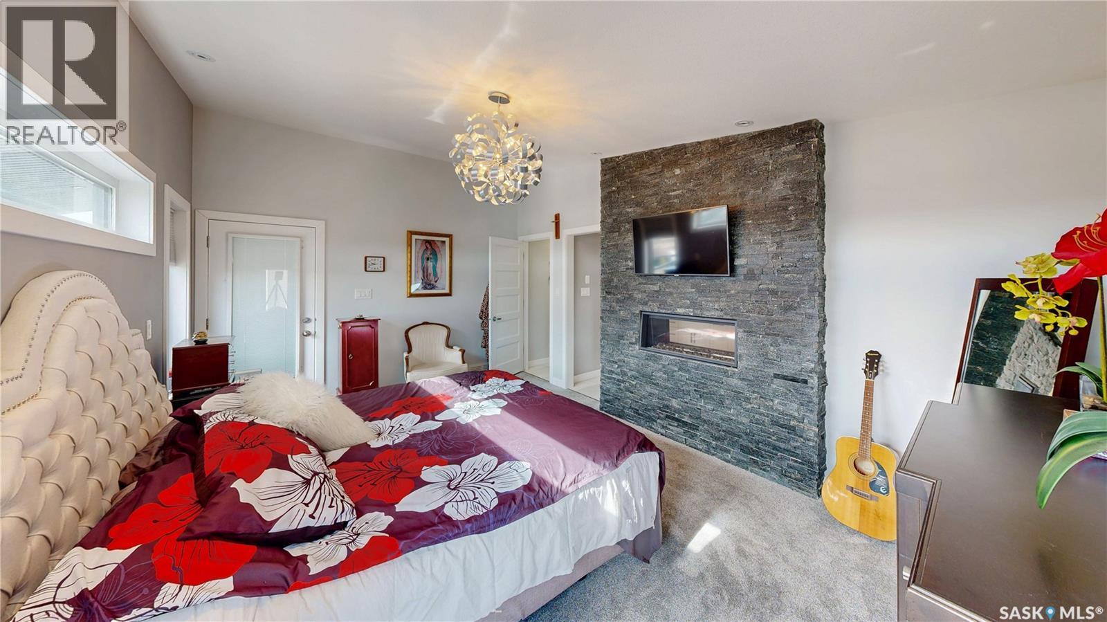 4369 Albulet Drive, Regina, SK - Indoor Photo Showing Bedroom With Fireplace