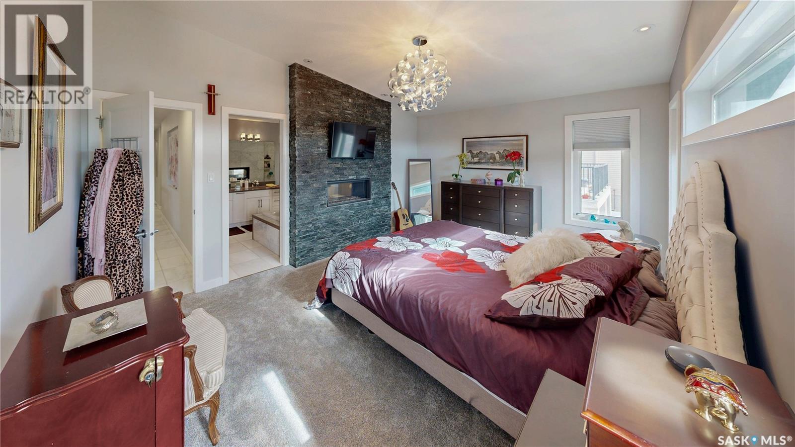 4369 Albulet Drive, Regina, SK - Indoor Photo Showing Bedroom With Fireplace