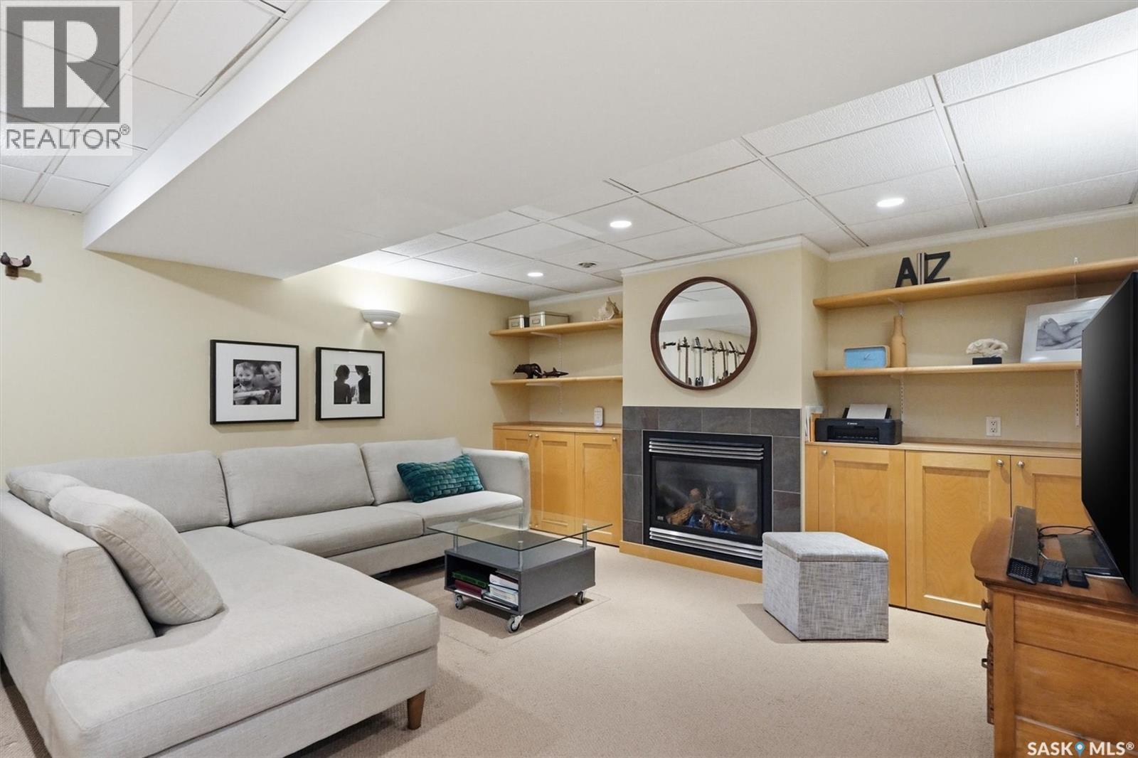 25 Tupper Crescent, Saskatoon, SK - Indoor Photo Showing Other Room With Fireplace