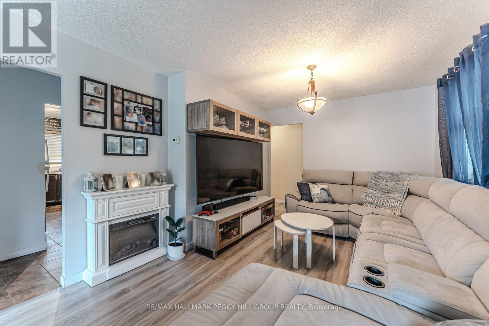 69 Fox Run, Barrie, ON - Indoor Photo Showing Living Room With Fireplace
