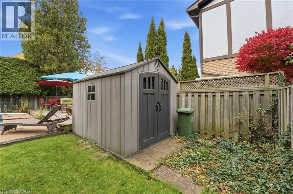 View of shed featuring a fenced backyard - 668 Tomahawk Crescent, Ancaster, ON - Outdoor