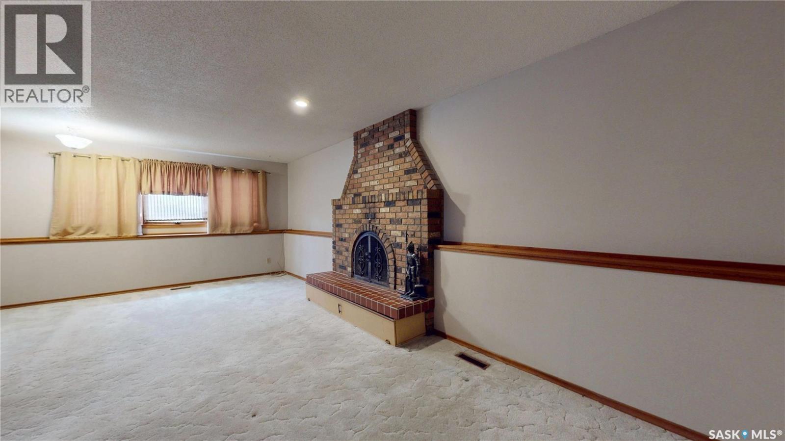 114 Windfield Road, Regina, SK - Indoor Photo Showing Other Room With Fireplace