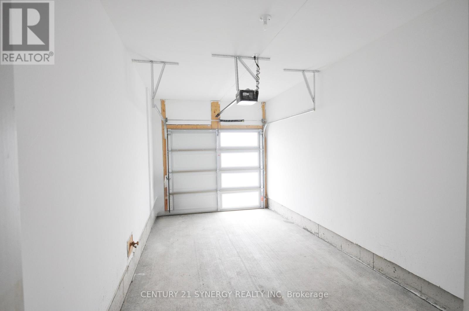 Garage with light panels in garage door - 284 Ormiston Crescent, Ottawa, ON - Indoor Photo Showing Garage