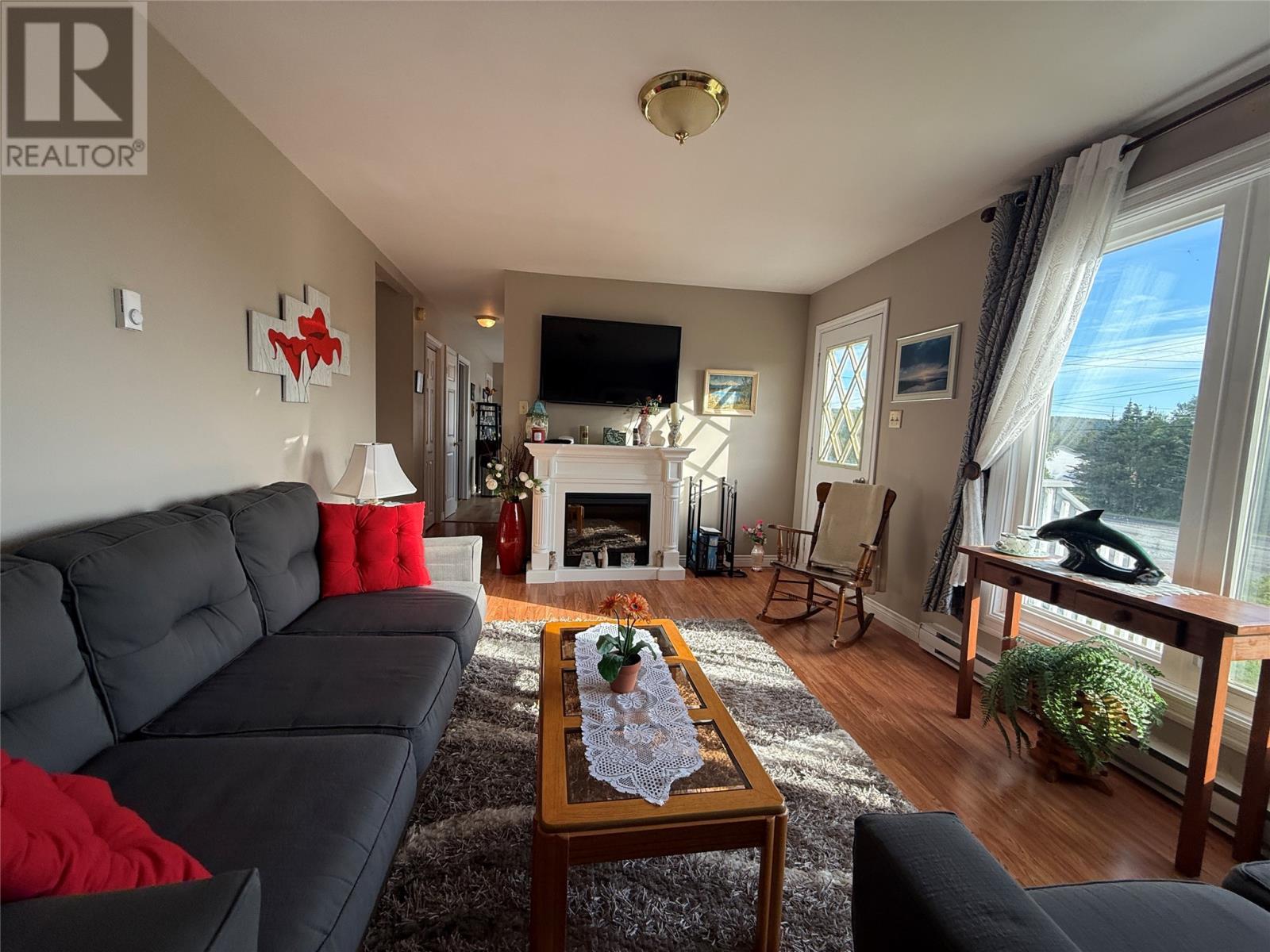 / - 68 Fox Harbour Road, Dunville, NL - Indoor Photo Showing Living Room With Fireplace