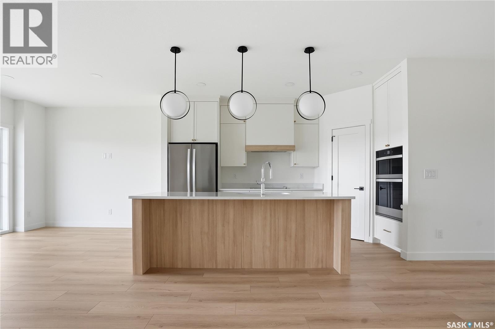 20 720 Brighton Boulevard, Saskatoon, SK - Indoor Photo Showing Kitchen With Upgraded Kitchen