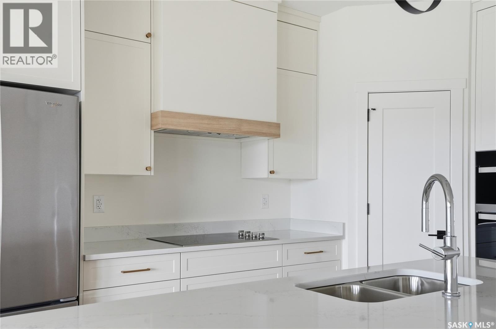 20 720 Brighton Boulevard, Saskatoon, SK - Indoor Photo Showing Kitchen With Double Sink With Upgraded Kitchen