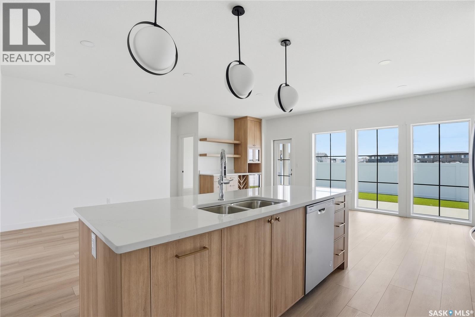 20 720 Brighton Boulevard, Saskatoon, SK - Indoor Photo Showing Kitchen With Double Sink