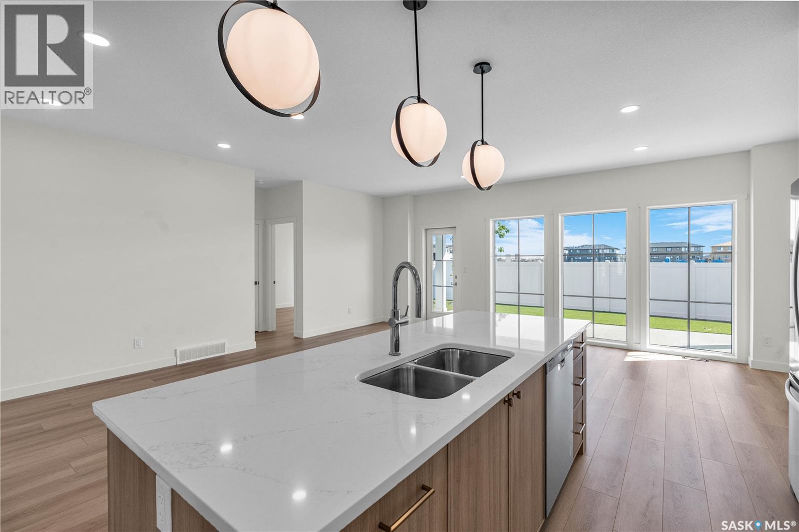 20 720 Brighton Boulevard, Saskatoon, SK - Indoor Photo Showing Kitchen With Double Sink