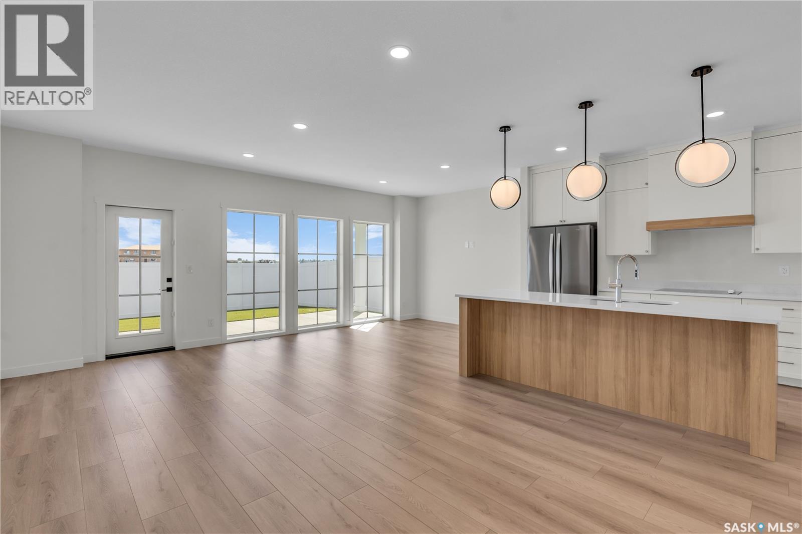 20 720 Brighton Boulevard, Saskatoon, SK - Indoor Photo Showing Kitchen With Upgraded Kitchen