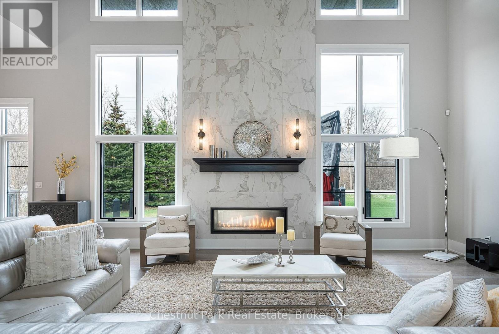 Great room with 2 sided fireplace - 1 Windrose Valley Boulevard, Clearview, ON - Indoor Photo Showing Living Room With Fireplace