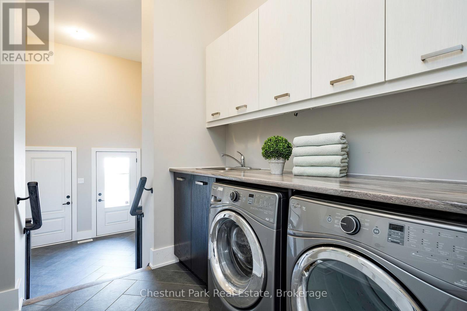 Main floor laundry room leading to the mudroom - 1 Windrose Valley Boulevard, Clearview, ON - Indoor Photo Showing Laundry Room
