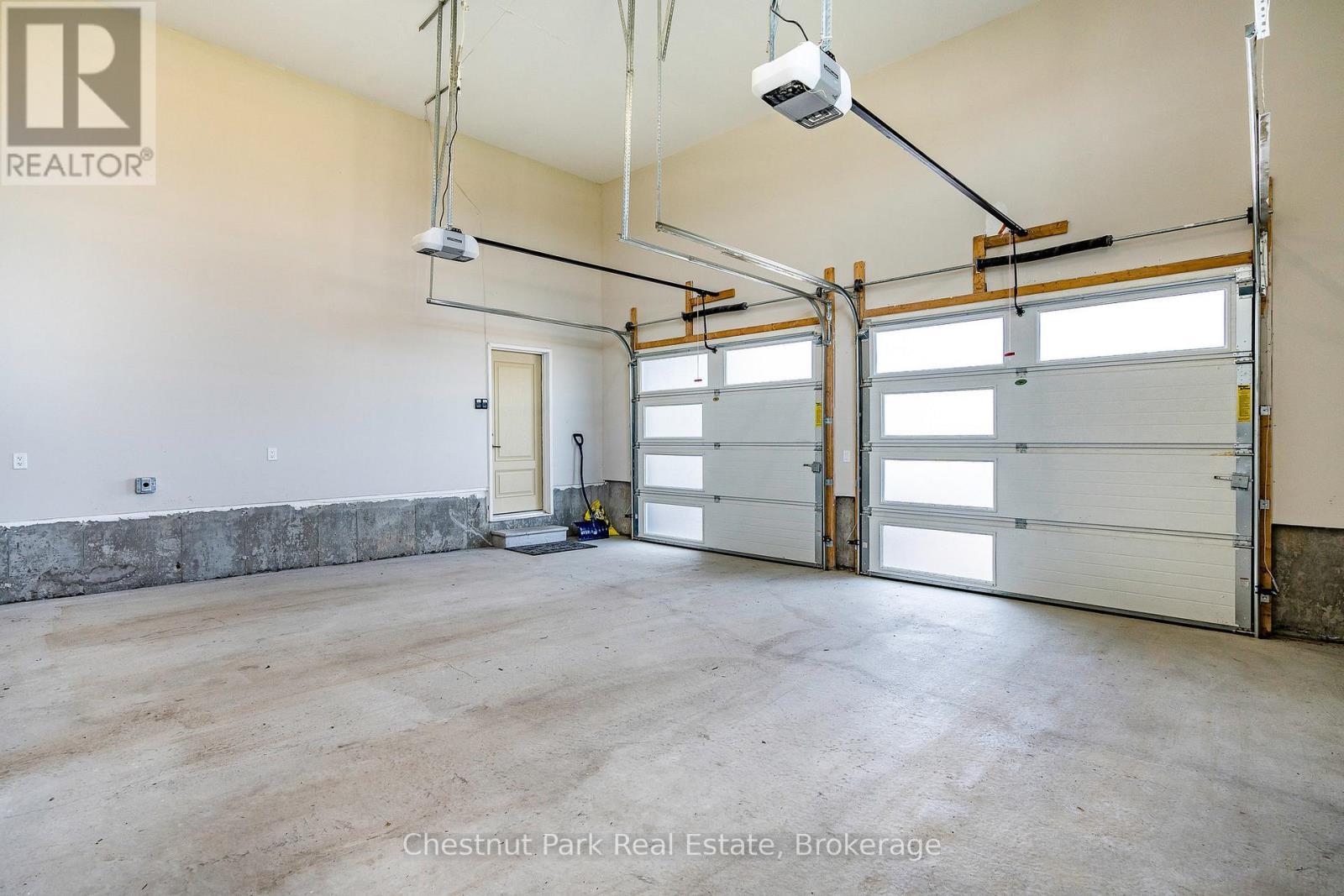 2 of the 3 garages (double car garage) - 1 Windrose Valley Boulevard, Clearview, ON - Indoor Photo Showing Garage