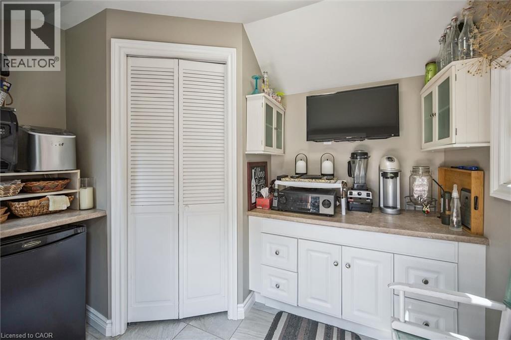 White louvered bifold doors complement the surrounding gray wall - 574 Sprucehill Avenue, Waterloo, ON - Indoor Photo Showing Other Room