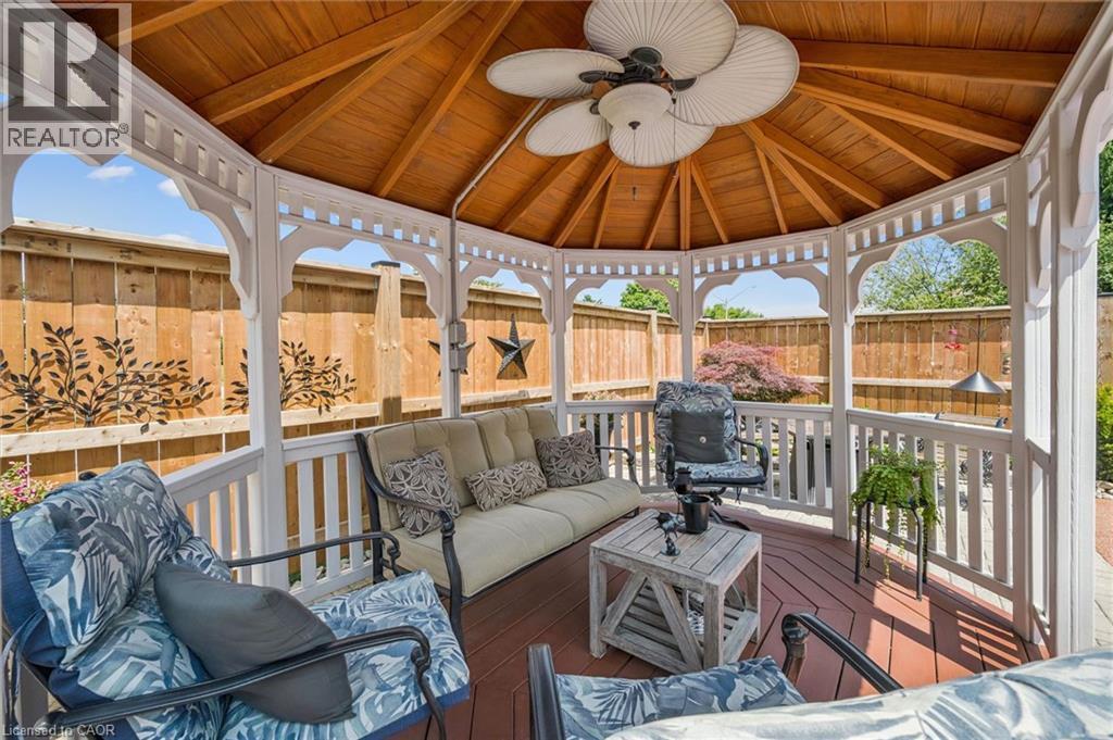 Octagonal white gazebo featuring a wood-finish vaulted ceiling with a ceiling fan - 574 Sprucehill Avenue, Waterloo, ON - Outdoor With Deck Patio Veranda With Exterior