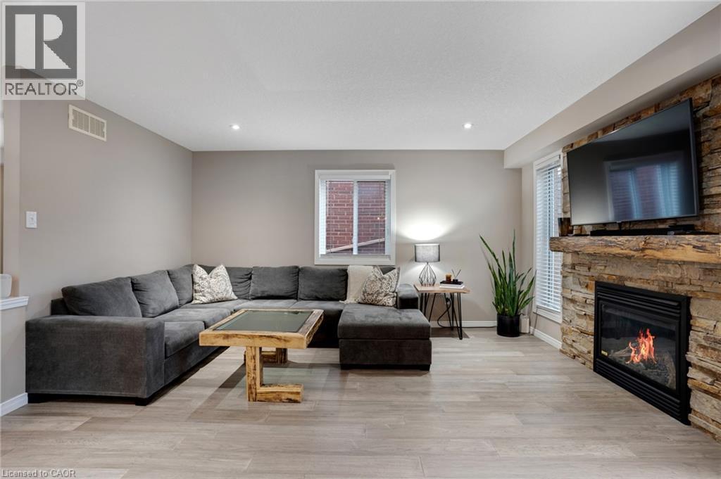 99 Udvari Crescent, Kitchener, ON - Indoor Photo Showing Living Room With Fireplace