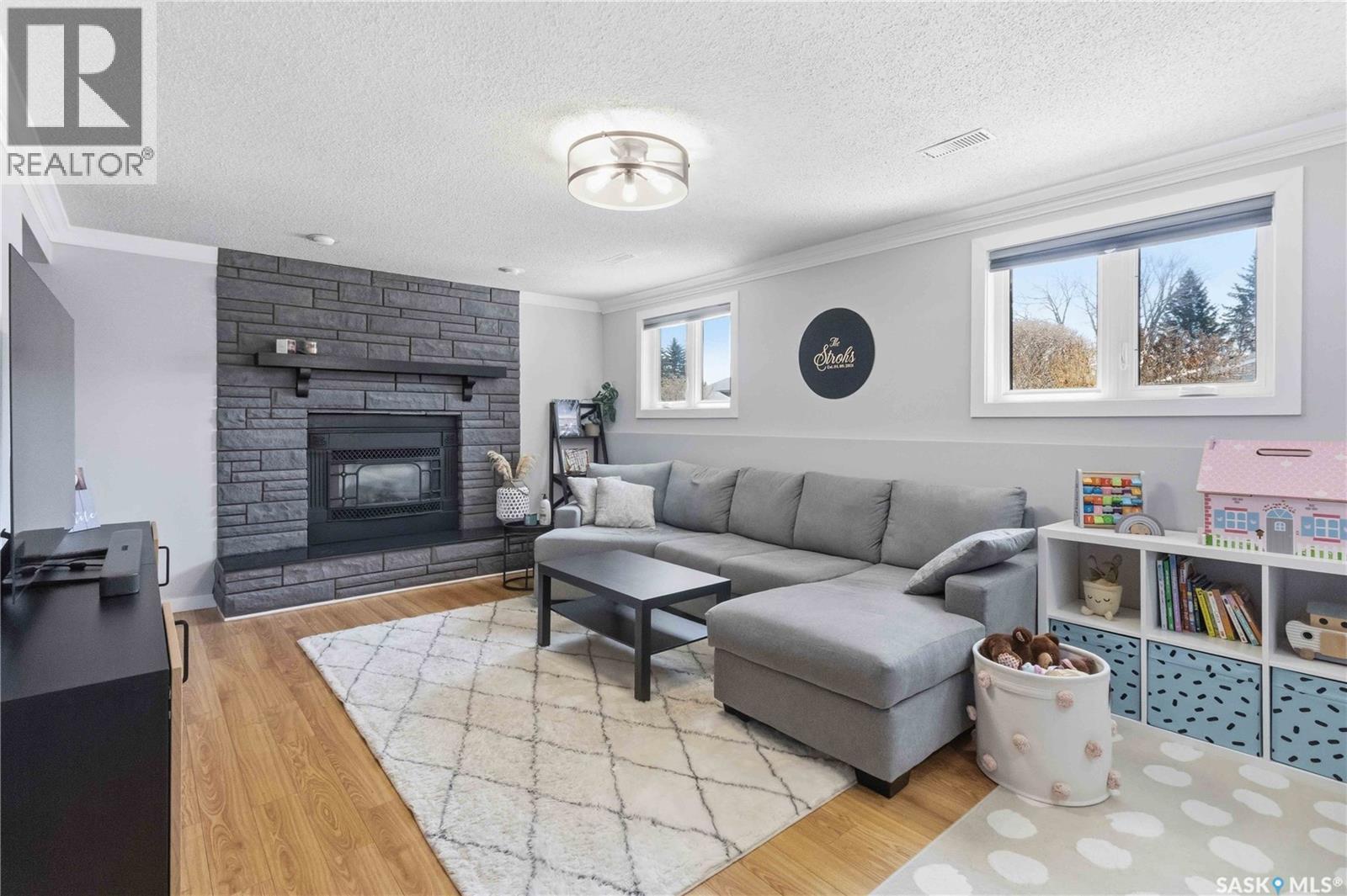363 Candle Crescent, Saskatoon, SK - Indoor Photo Showing Living Room With Fireplace