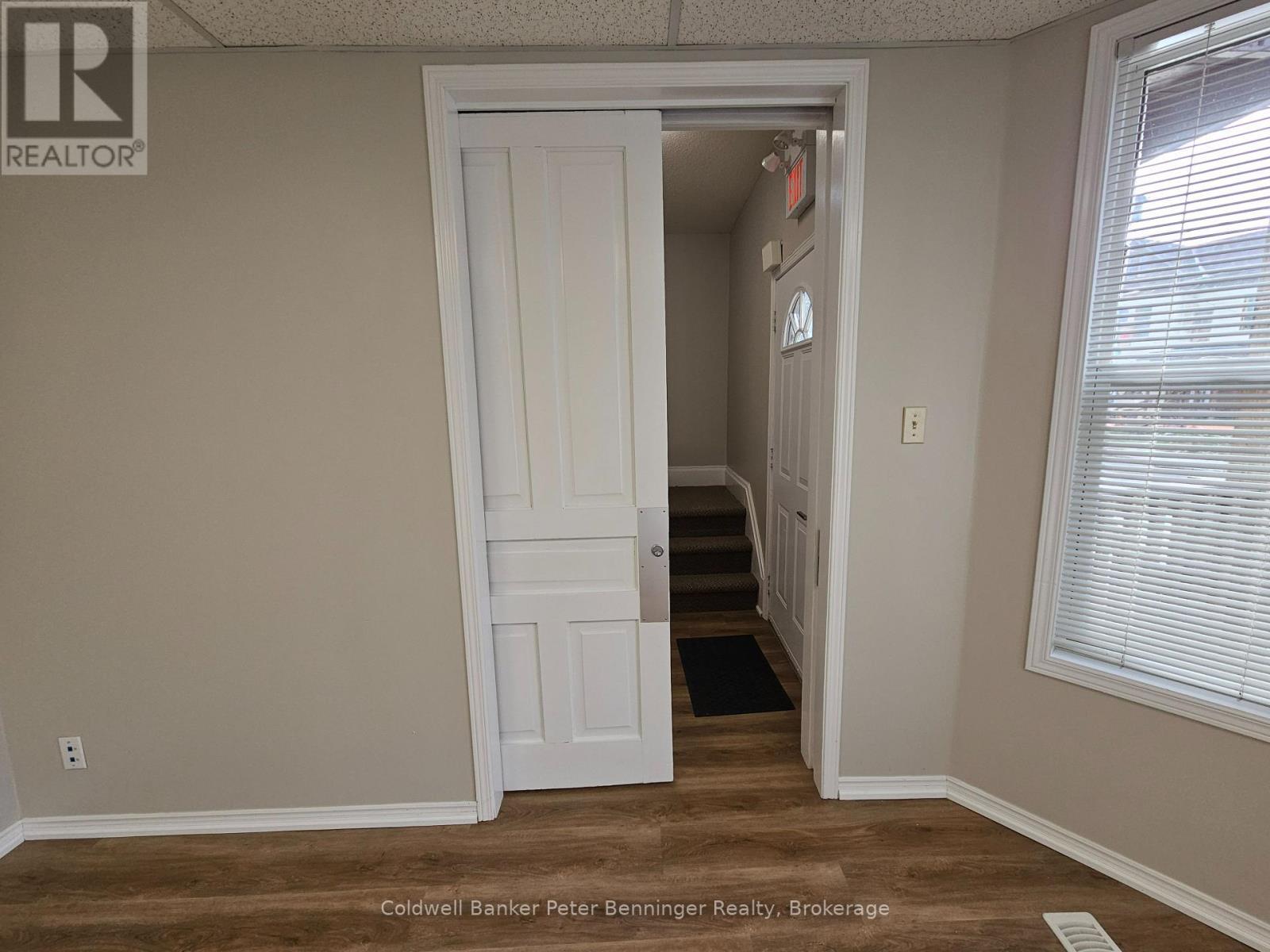 sliding pocket door on front office - 100 Lancaster Street E, Kitchener, ON