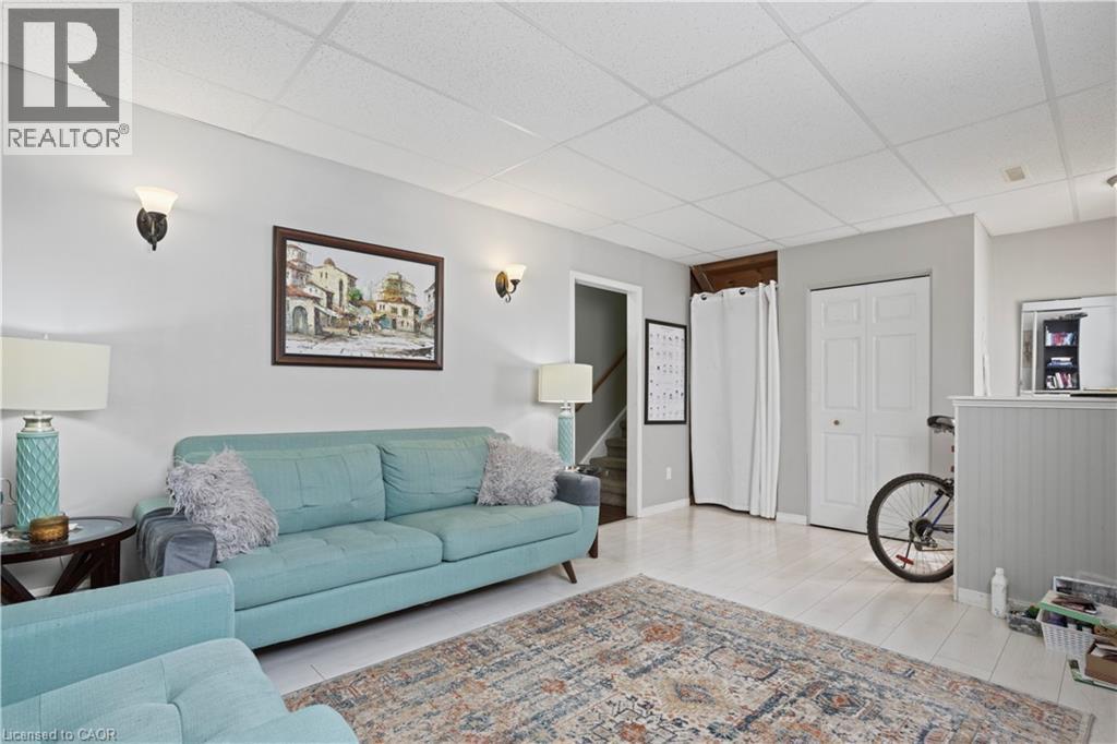 Finished interior space featuring light-colored walls and wood-finish flooring - 179 Vancouver Street, London, ON - Indoor Photo Showing Living Room