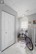 Entryway featuring light-toned wood-finish flooring, a bi-fold closet, and neutral gray wall paint -
