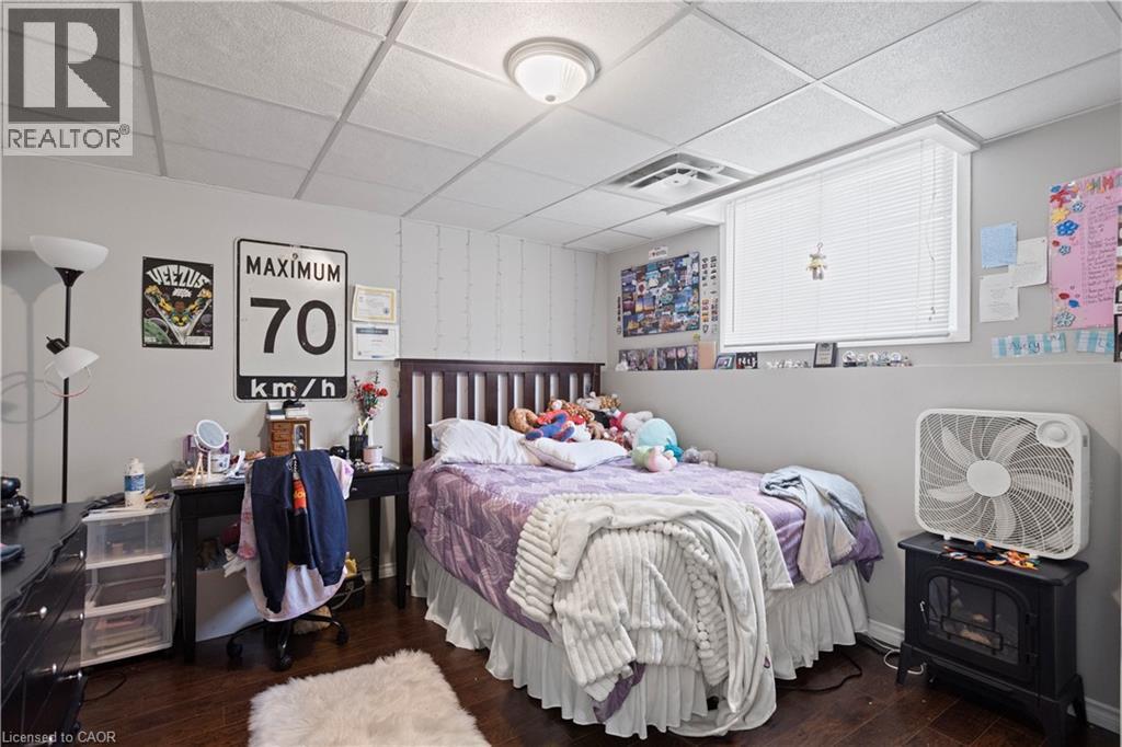 Bedroom featuring wood-finish flooring, light gray walls, and a drop ceiling - 179 Vancouver Street, London, ON - Indoor Photo Showing Bedroom