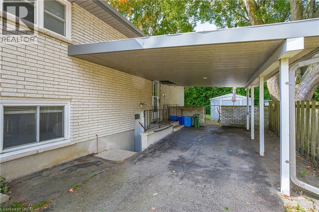 Covered carport structure with support posts - 179 Vancouver Street, London, ON - Outdoor With Exterior