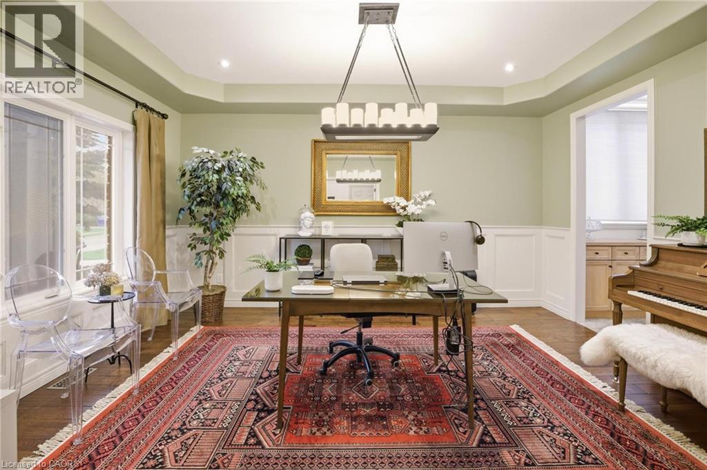 Spacious room with wood-finish flooring, wainscoting, and recessed lighting - 129 Magnificent Way, Binbrook, ON - Indoor Photo Showing Office