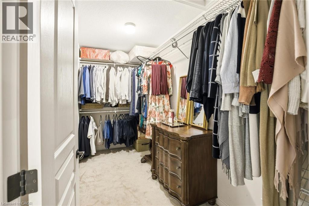 Spacious walk-in closet featuring wire shelving, multiple hanging rods, and recessed lighting - 129 Magnificent Way, Binbrook, ON - Indoor With Storage