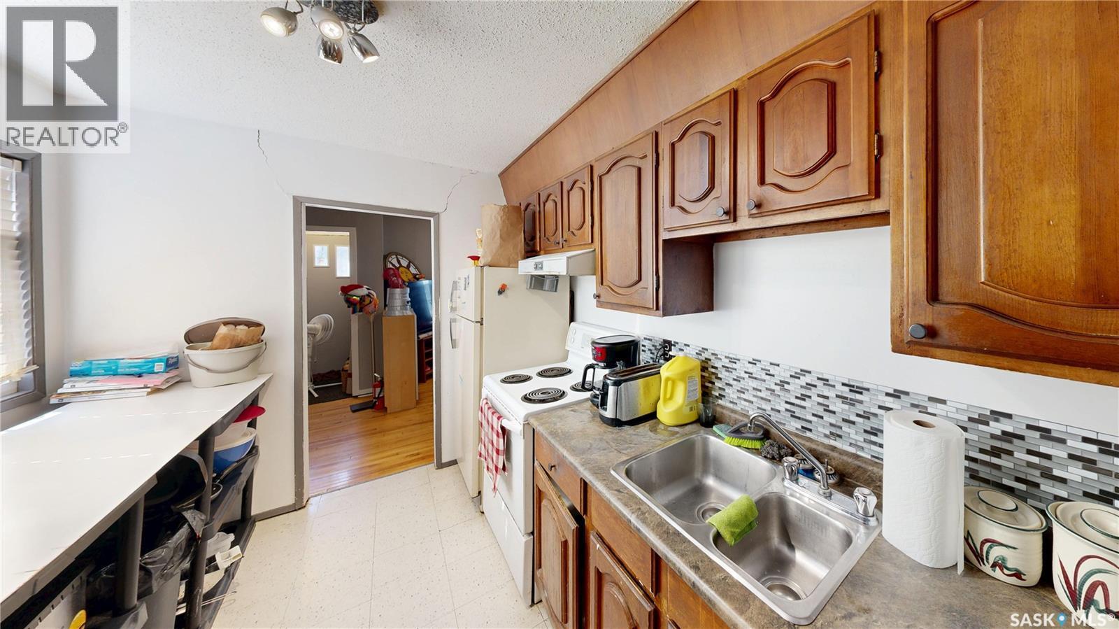 20 Cecil Crescent, Regina, SK - Indoor Photo Showing Kitchen With Double Sink