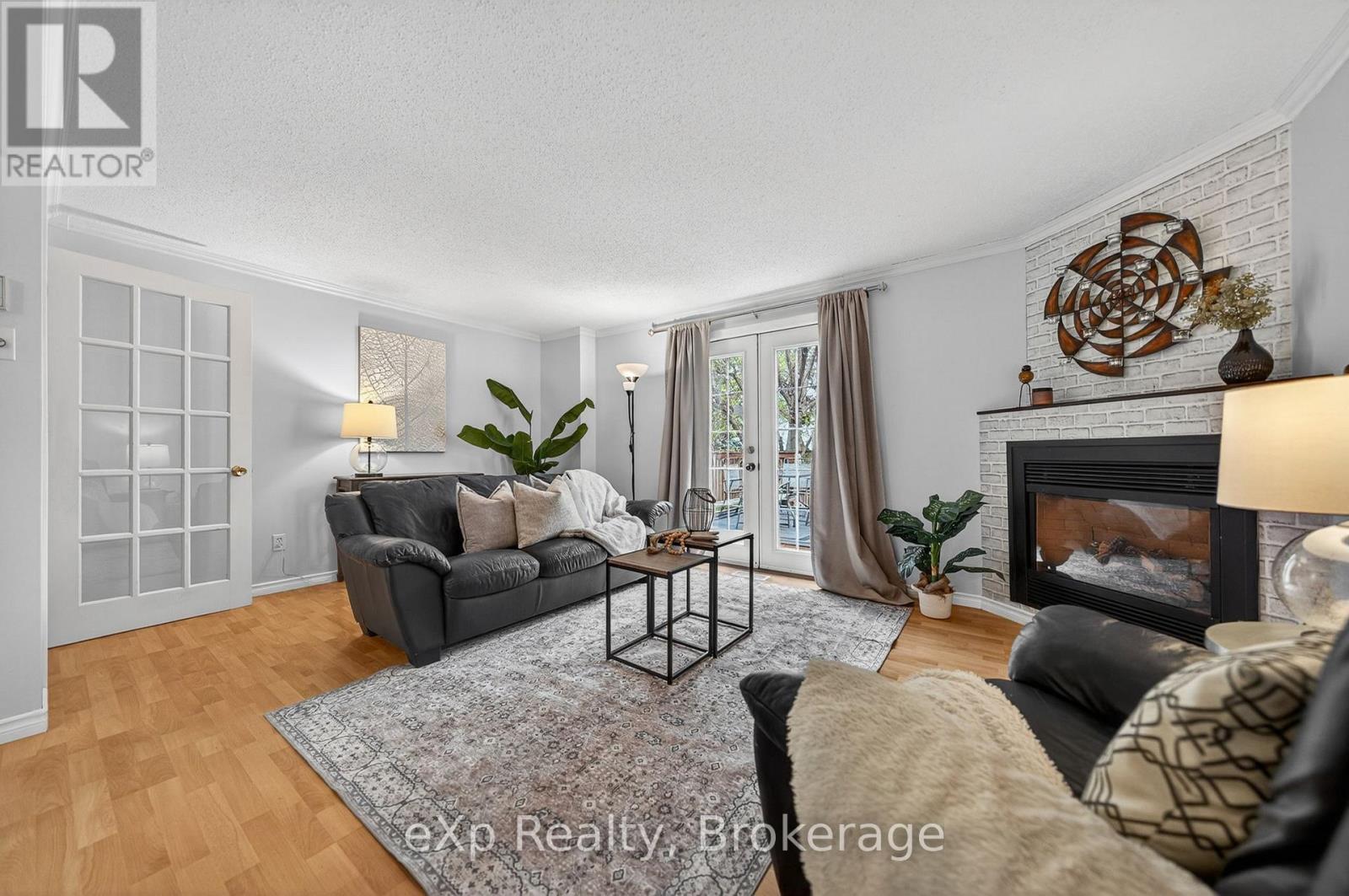 111 Connelly Drive, Kitchener, ON - Indoor Photo Showing Living Room With Fireplace
