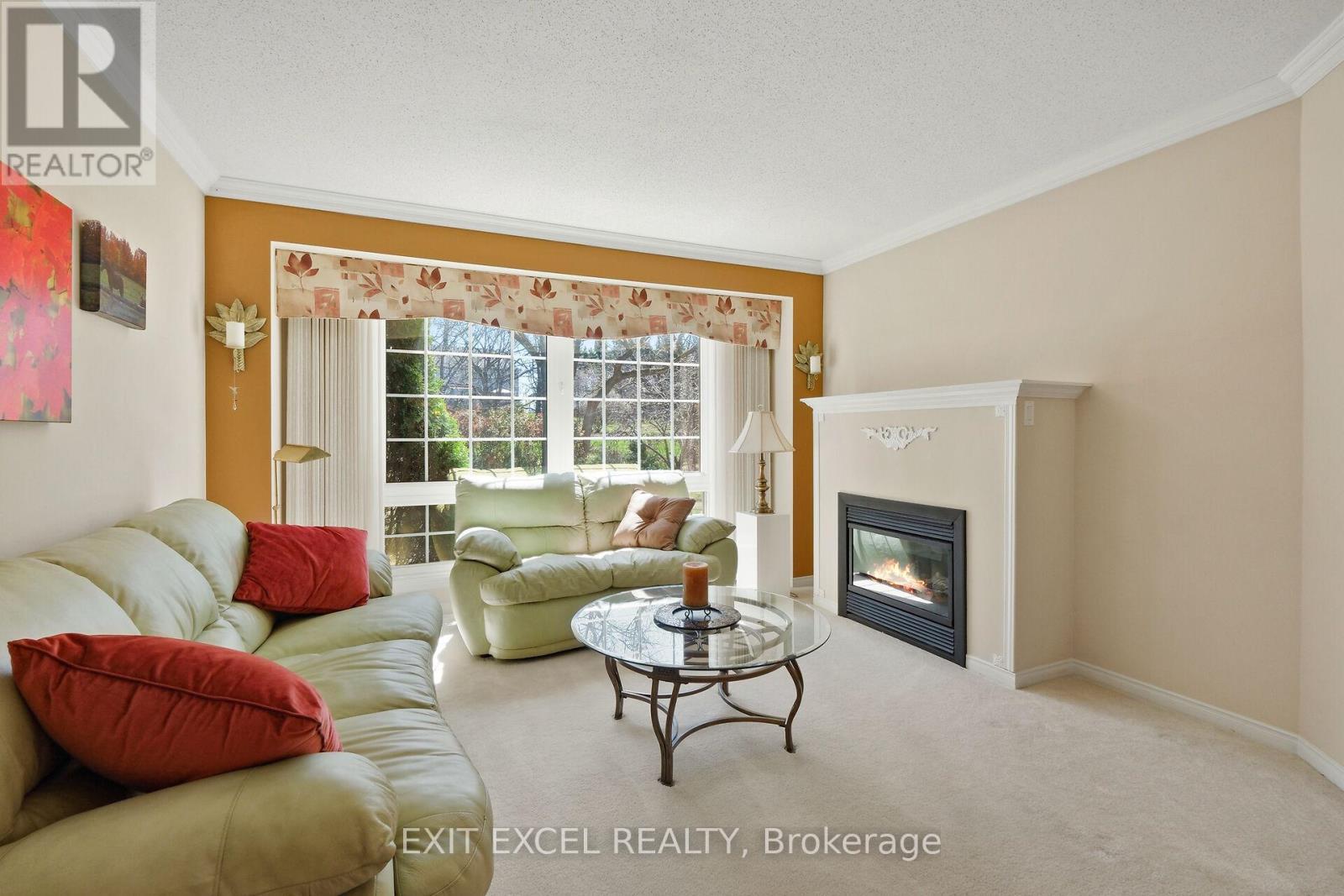 67 Hawktree, Ottawa, ON - Indoor Photo Showing Living Room With Fireplace
