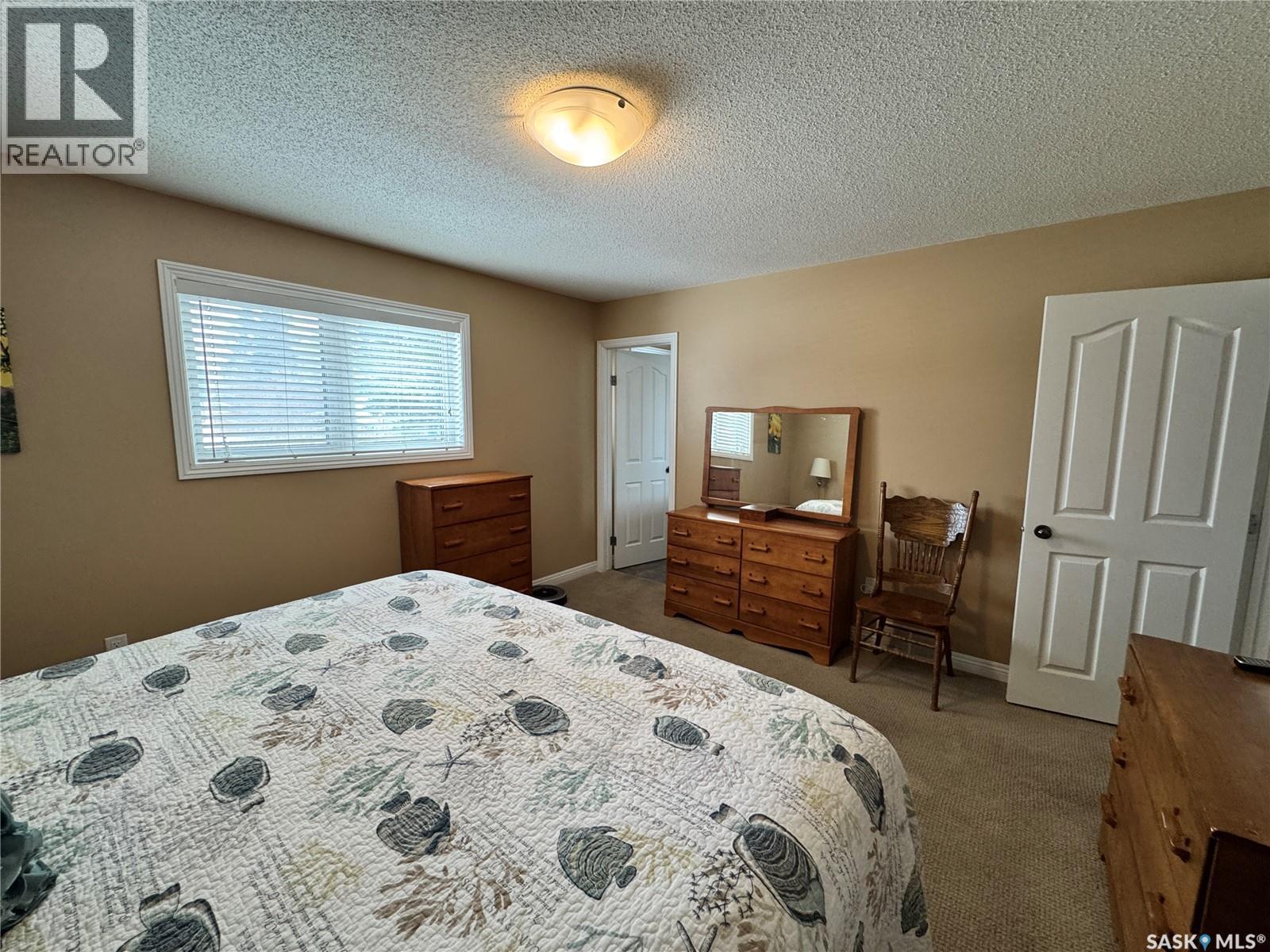 218 5Th Avenue E, Biggar, SK - Indoor Photo Showing Bedroom