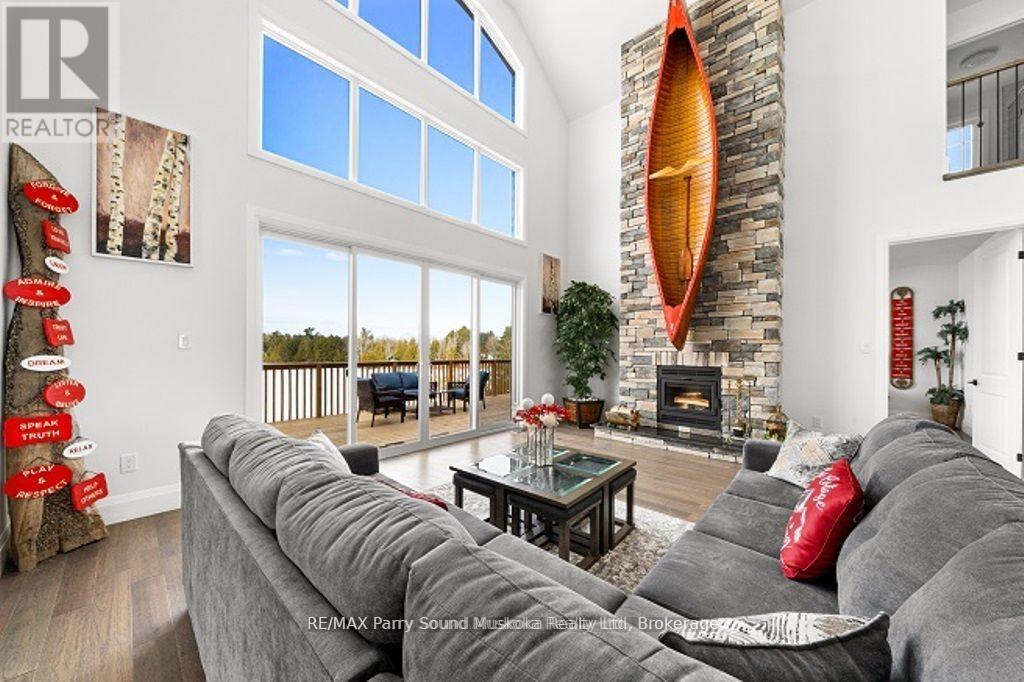 730 124 Highway, Mckellar, ON - Indoor Photo Showing Living Room With Fireplace