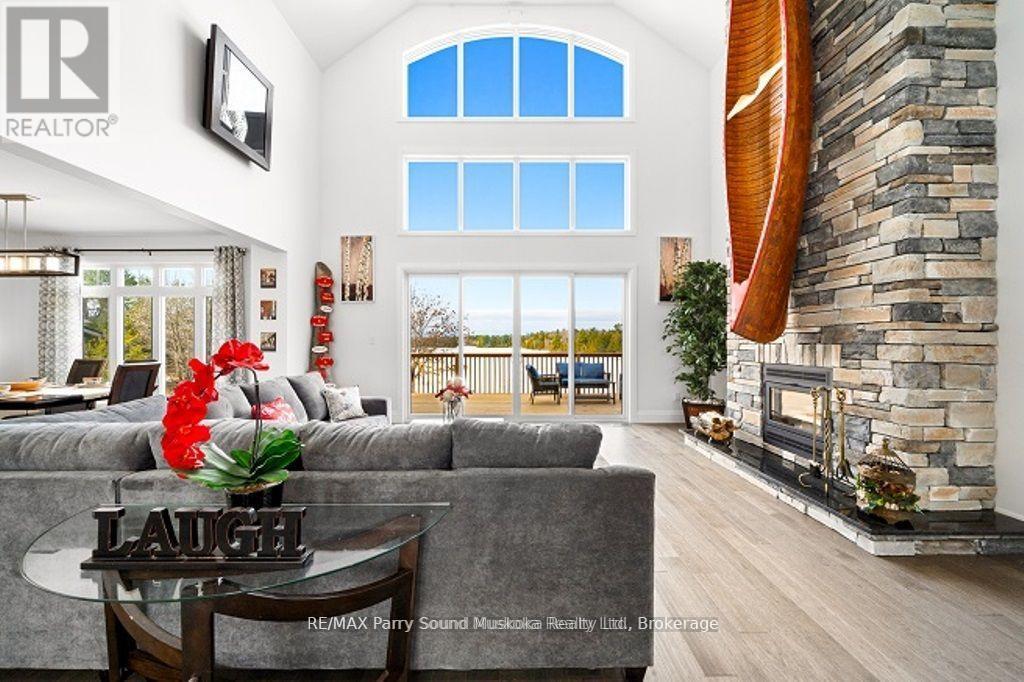 730 124 Highway, Mckellar, ON - Indoor Photo Showing Living Room With Fireplace