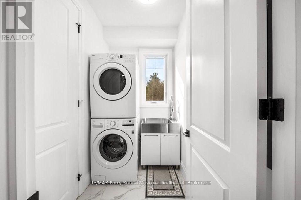 Main Floor Laundry - 730 124 Highway, Mckellar, ON - Indoor Photo Showing Laundry Room