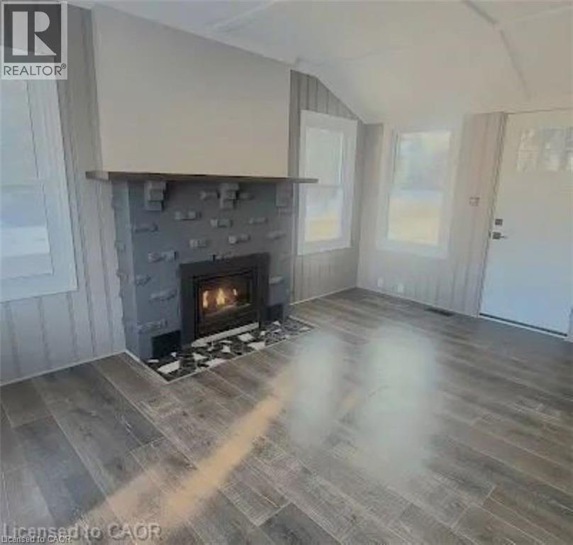 96 Orchard Avenue, Simcoe, ON - Indoor Photo Showing Living Room With Fireplace