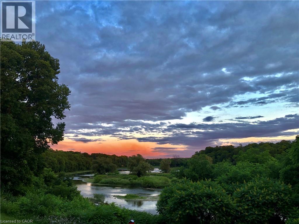 Incredible sunrises in the morning over The Grand River. - 245 Bishop Street S Unit# 4, Cambridge, ON - Outdoor With View