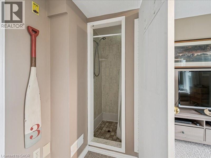 Walk-in shower featuring tiled walls and a coordinating tiled floor - 245 Bishop Street S Unit# 4, Cambridge, ON - Indoor