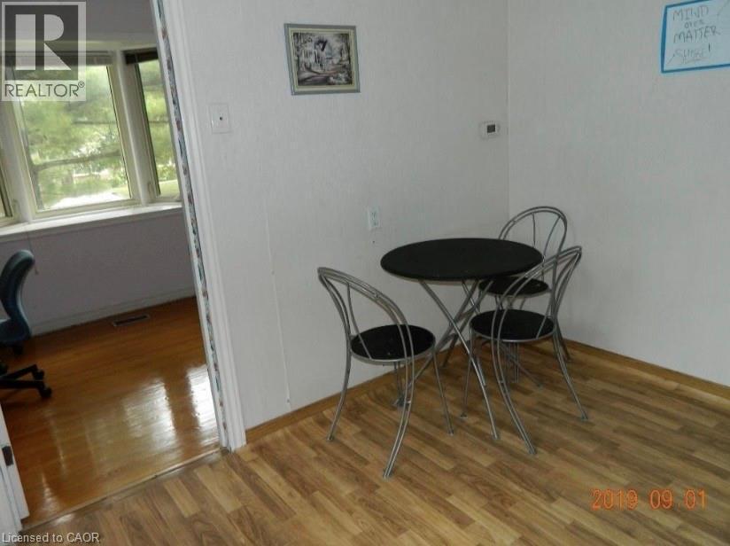 Wood-finish flooring provides a cohesive aesthetic - 134 Greenbrier Drive, Waterloo, ON - Indoor
