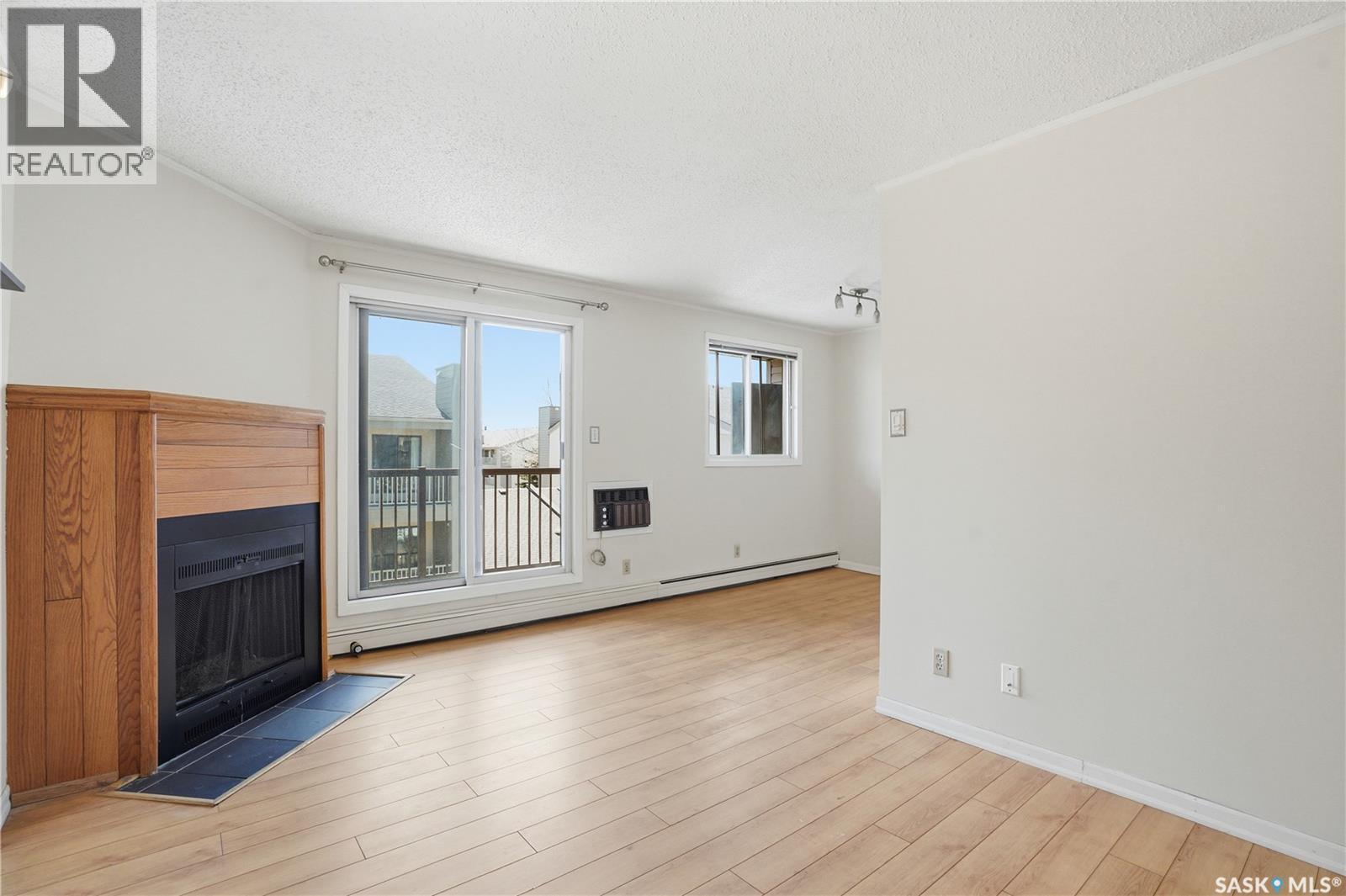 316B 4040 8Th Street E, Saskatoon, SK - Indoor Photo Showing Other Room With Fireplace