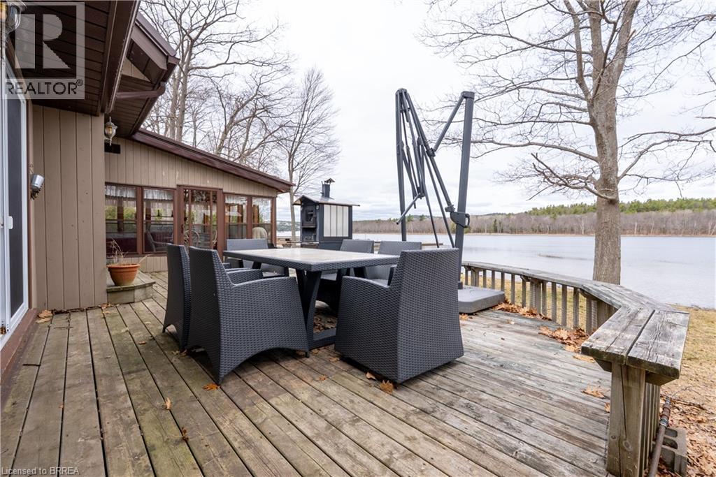 344 Perry Avenue, Killarney, ON - Outdoor With Body Of Water With Deck Patio Veranda With Exterior