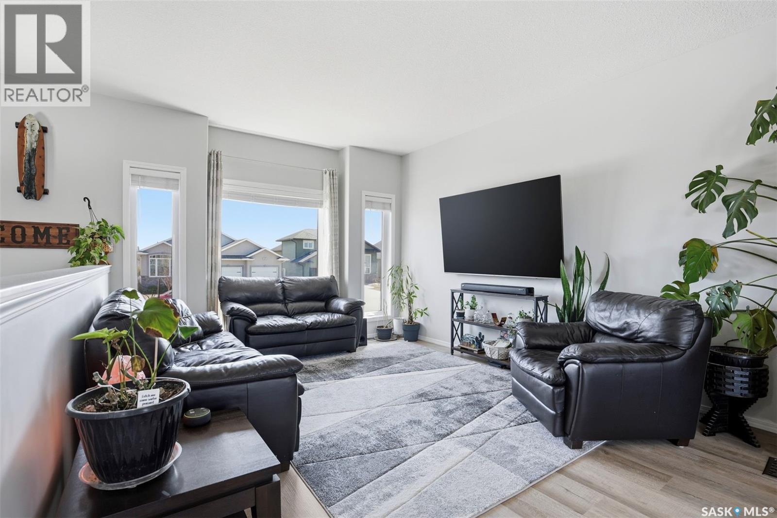 330 Player Crescent, Warman, SK - Indoor Photo Showing Living Room With Fireplace