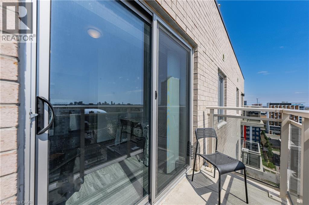 Private balcony featuring concrete flooring and a metal and glass railing - 246 Lester Street Unit# Ph-03, Waterloo, ON - Outdoor With Balcony With Exterior