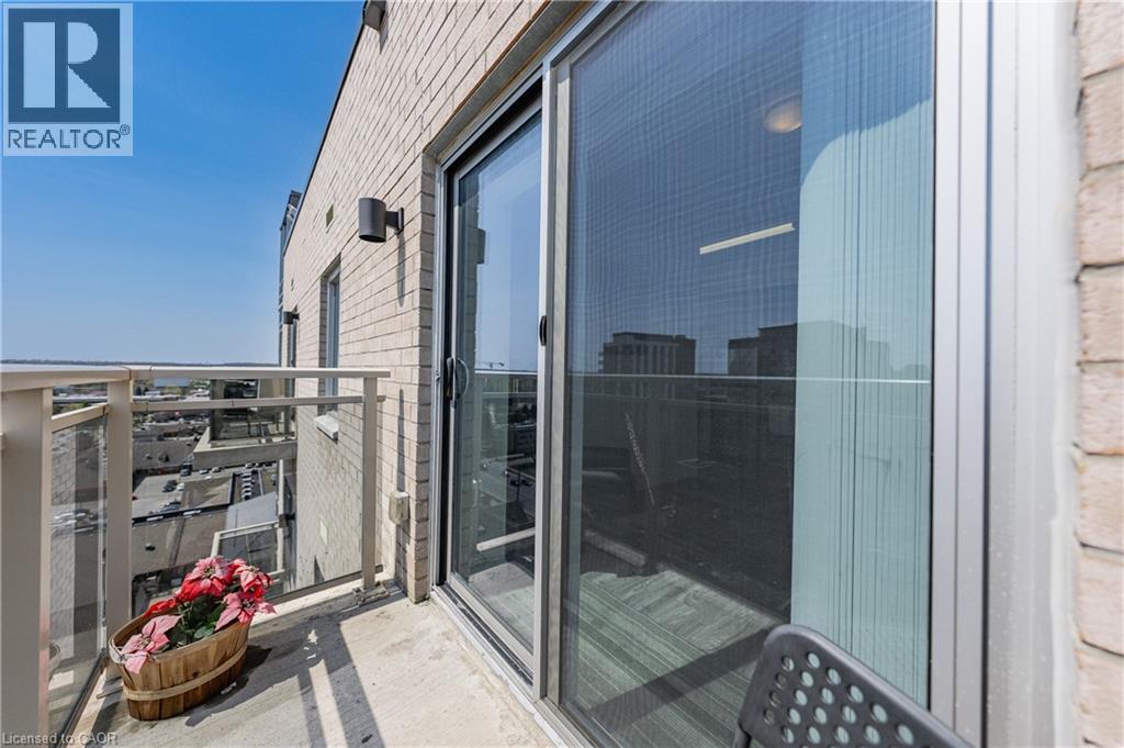 Private balcony featuring a concrete floor, glass and metal railings, and a sliding glass door entry - 246 Lester Street Unit# Ph-03, Waterloo, ON - Outdoor With Balcony With Exterior