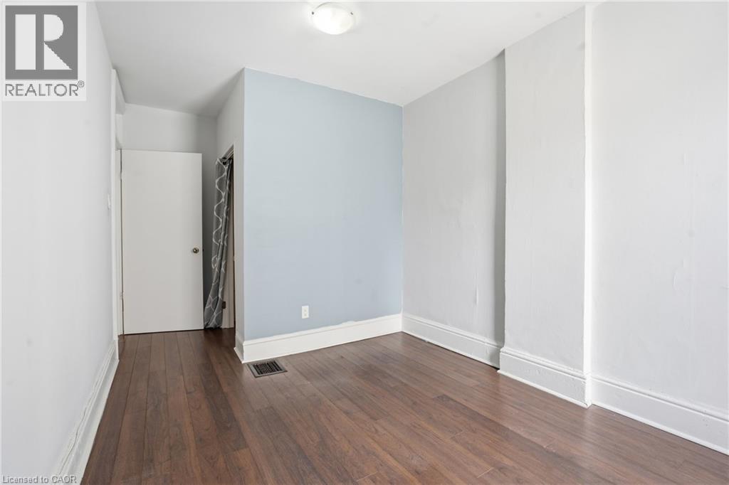 Hardwood-style flooring throughout - 137 Market Street, Hamilton, ON - Indoor Photo Showing Other Room