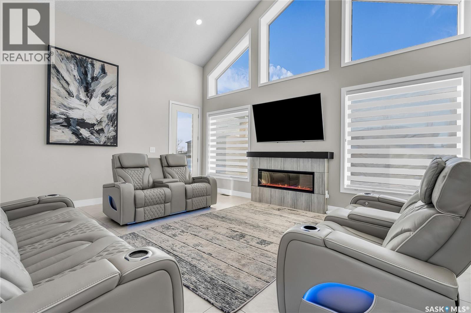7 Loewen Court, Warman, SK - Indoor Photo Showing Living Room With Fireplace
