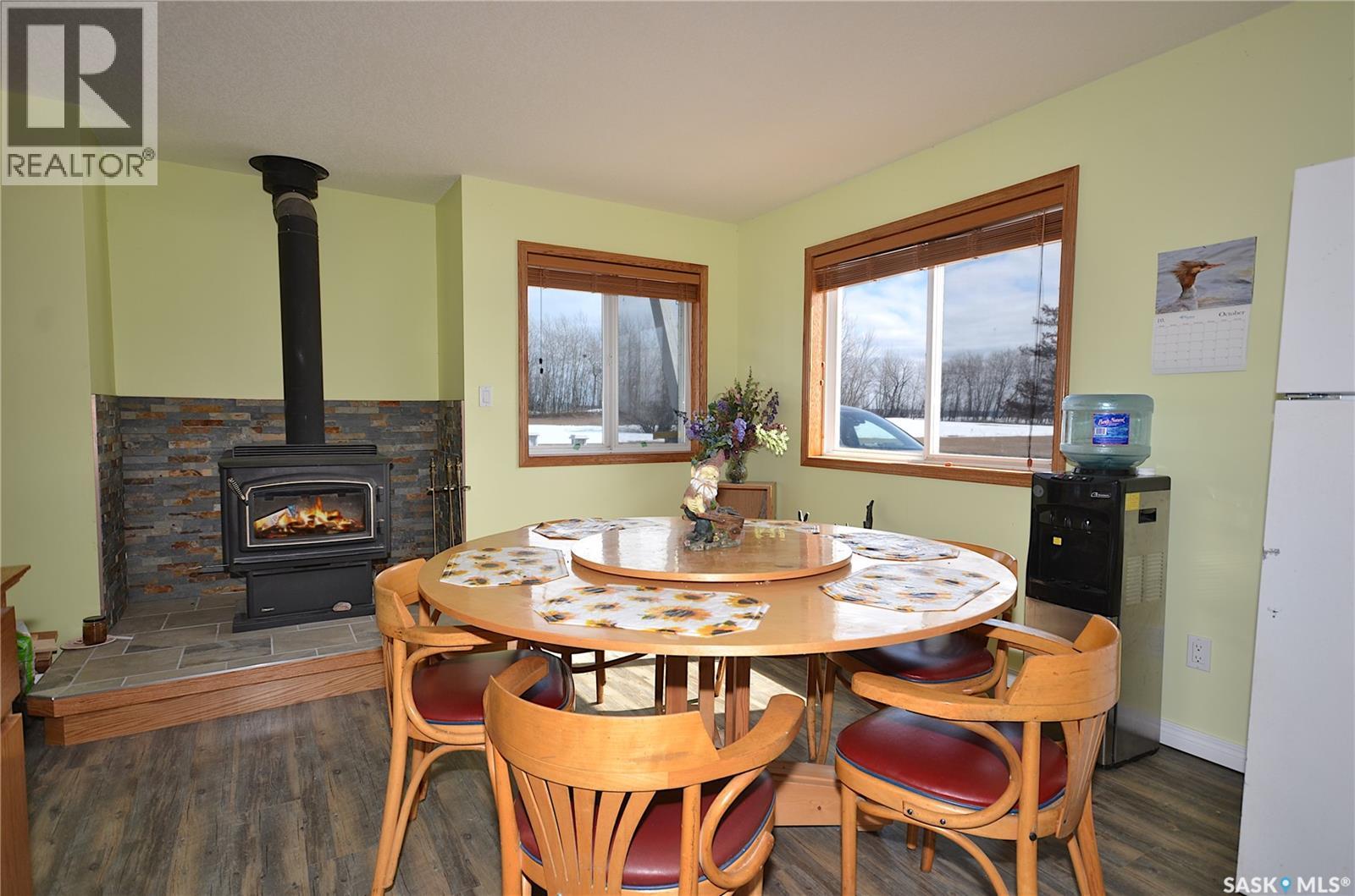 6 Bronco Drive, Delaronde Lake, SK - Indoor Photo Showing Dining Room With Fireplace