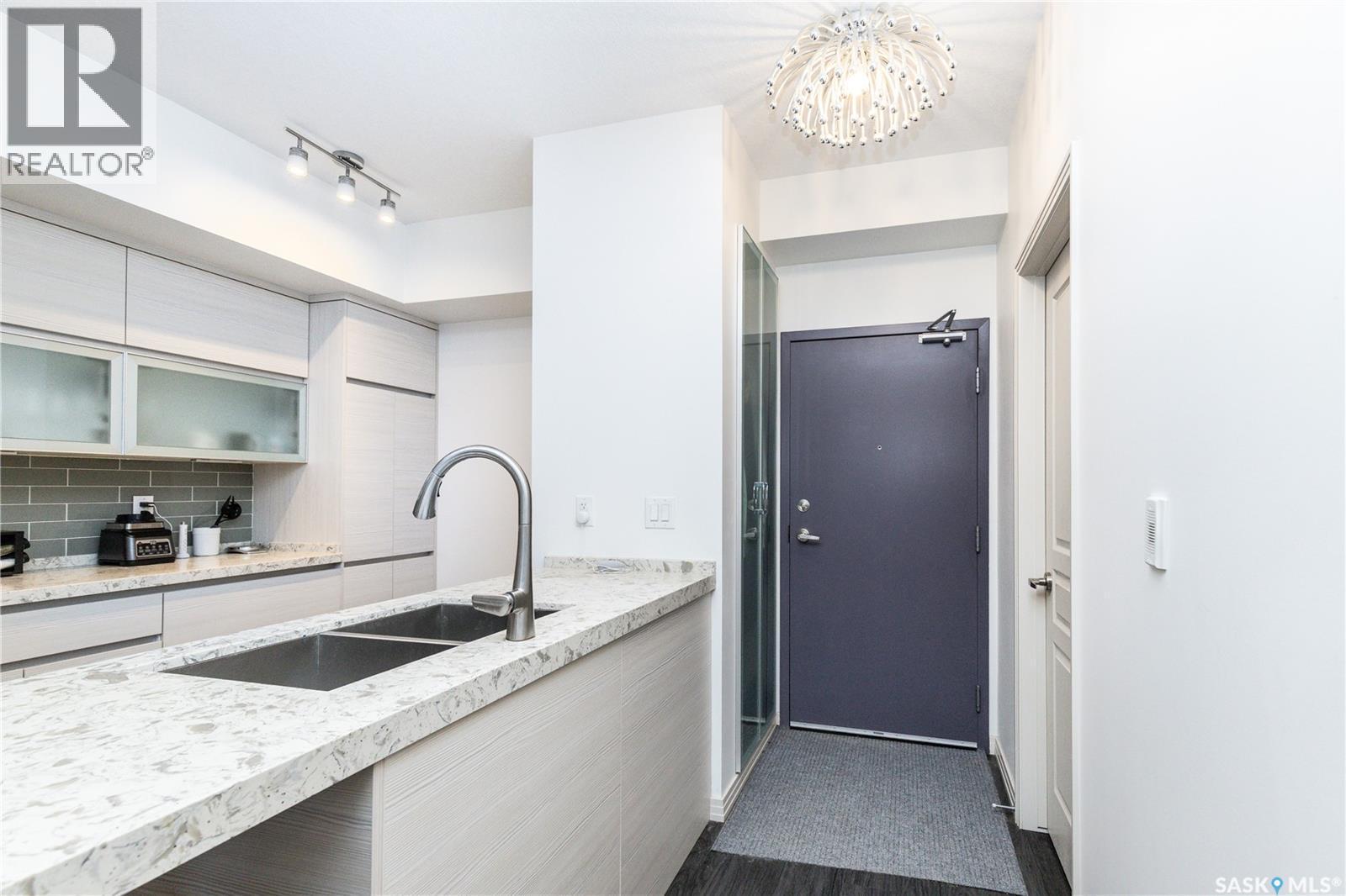 122 223 Evergreen Square, Saskatoon, SK - Indoor Photo Showing Kitchen With Double Sink