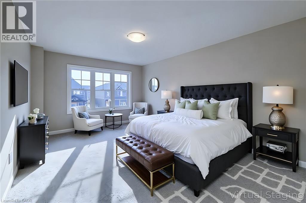 Spacious bedroom featuring light neutral wall tones, plush gray carpeting, a large multipane window, and a flush-mount ceiling light fixture - 111 Alicia Crescent, Thorold, ON