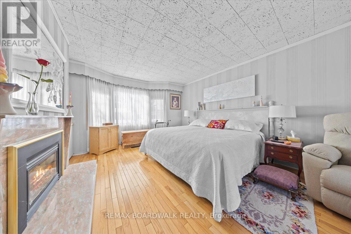 961 Kingsmere Avenue, Ottawa, ON - Indoor Photo Showing Bedroom With Fireplace
